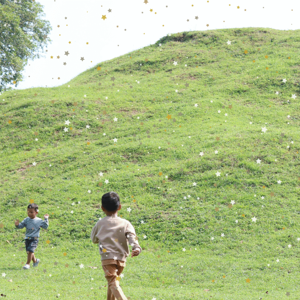 Kids playing on a hill for Cheese Rolling Day article