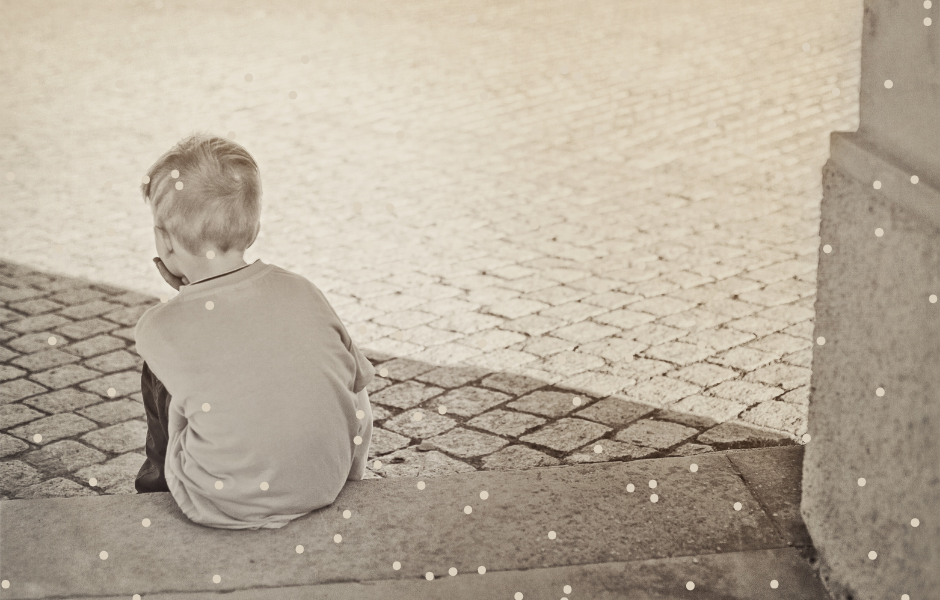 Boy sitting on his own - Children's English article loneliness Awareness Week