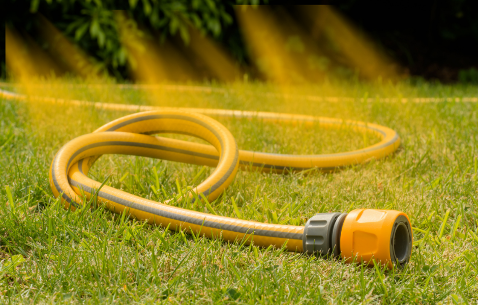 A hose on the grass. Why millions of people in England can’t use hosepipes this summer
