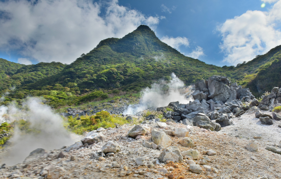 Hot spring with mountains behind