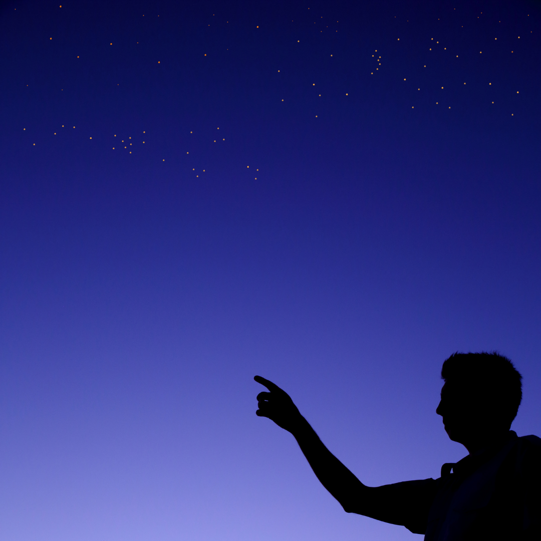 Someone pointing at the dark sky - Venus and Mercury line up this November